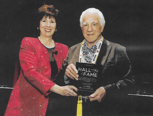 Geno Biggi accepting a Hall of Fame award