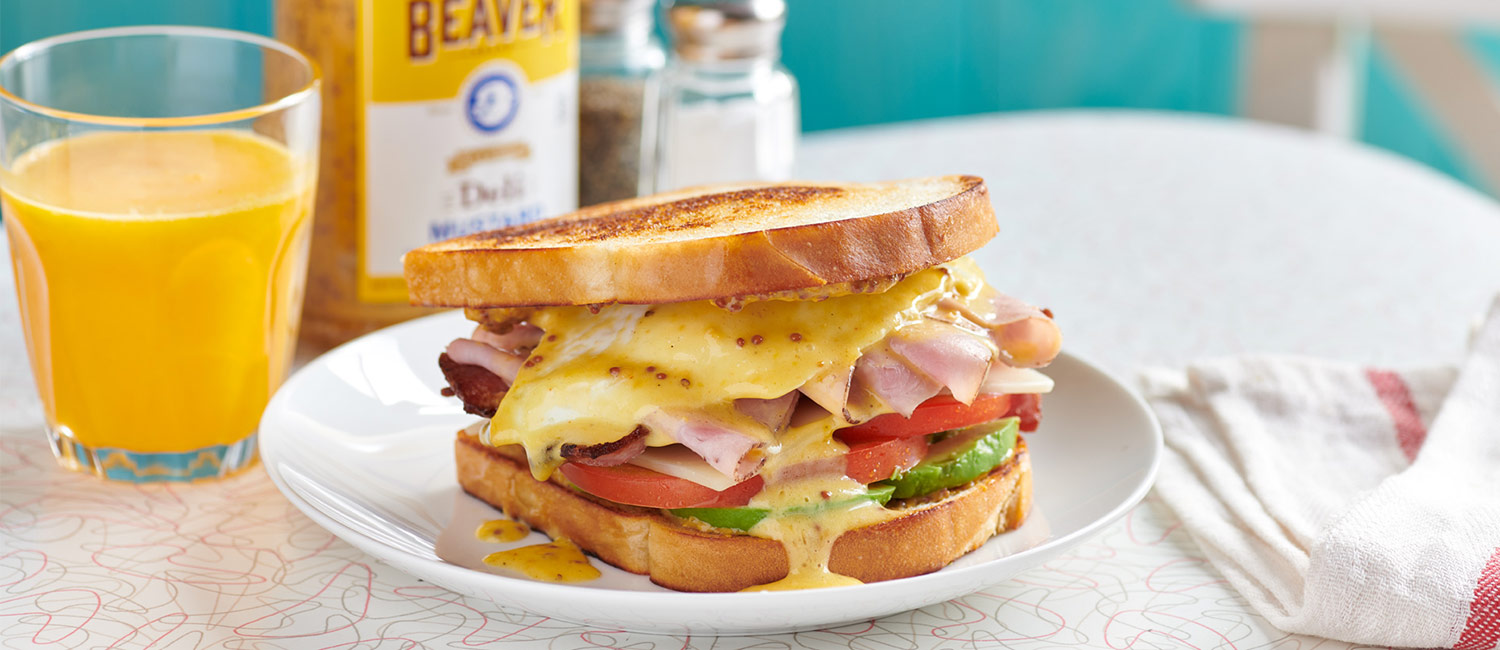 American breakfast sandwich with Beaver Brand Deli Mustard hollandaise sauce